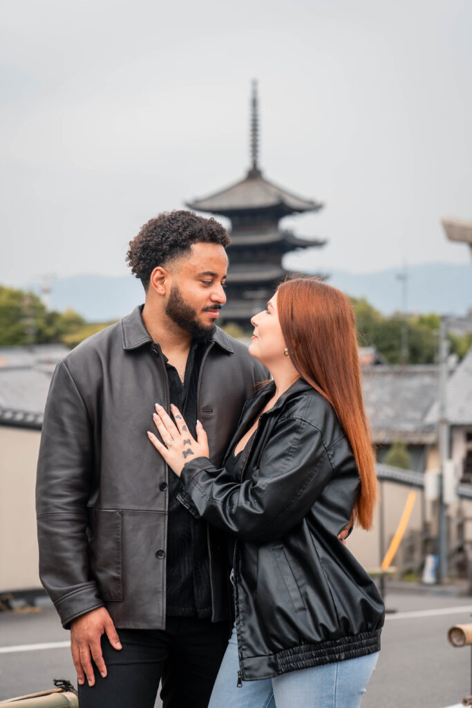 couple looking at each other with Yasaka Pagoda in the background