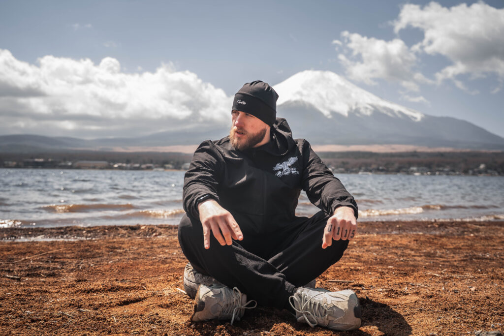 male portrait posing with Mount Fuji in the background at Lake Yamanaka